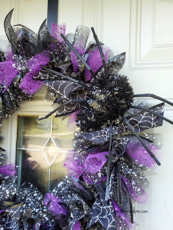 Halloween Deco Mesh Spider Wreath DIY. Use this easy step-by-step tutorial to learn how to make a Halloween deco mesh wreath. Under $10 to make with supplies from your local dollar store, this really is a unique, festive Halloween wreath for your home.