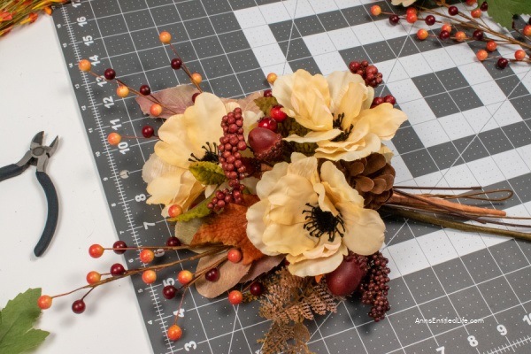 Fall Lantern Swag Decorations. When the autumn leaves start to fall and it is time to switch out your summer decor for fall decorations, an easy way to update your home decor is to change the swags on your lanterns. Use these easy step-by-step directions to make these beautiful fall lantern swag decorations.