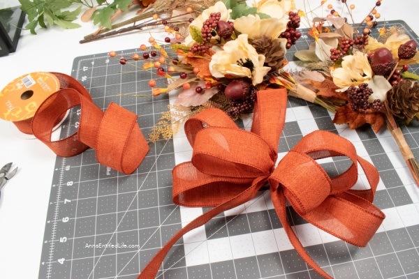 Fall Lantern Swag Decorations. When the autumn leaves start to fall and it is time to switch out your summer decor for fall decorations, an easy way to update your home decor is to change the swags on your lanterns. Use these easy step-by-step directions to make these beautiful fall lantern swag decorations.