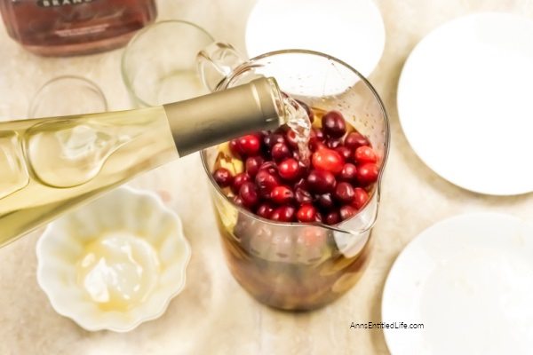 Holiday Cranberry Sangria Recipe. Need a fantastic sangria recipe for a holiday get-together or party? This holiday cranberry sangria recipe is light and refreshing yet packed with flavor and oh so easy to make! It is the best sangria recipe for holiday celebrations; a real crowd-pleaser.