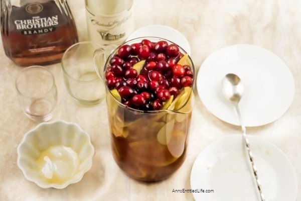 Holiday Cranberry Sangria Recipe. Need a fantastic sangria recipe for a holiday get-together or party? This holiday cranberry sangria recipe is light and refreshing yet packed with flavor and oh so easy to make! It is the best sangria recipe for holiday celebrations; a real crowd-pleaser.