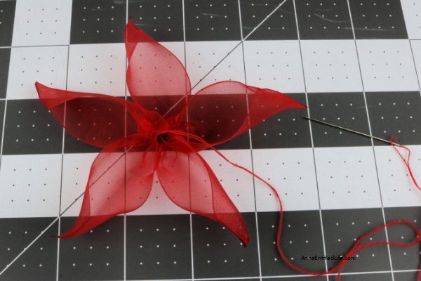 How to Make Poinsettia Ribbon Flowers. Follow these step-by-step instructions on how to make these easy poinsettia ribbon flowers with clips that you can display around your home or office. This is an easy craft once you get the hang of it. This fun craft will give you new accents for holiday decorations this Christmas season.