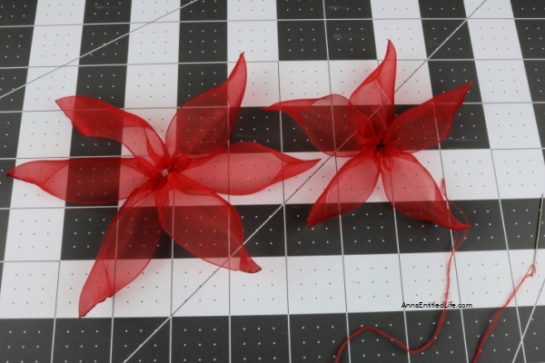 How to Make Poinsettia Ribbon Flowers. Follow these step-by-step instructions on how to make these easy poinsettia ribbon flowers with clips that you can display around your home or office. This is an easy craft once you get the hang of it. This fun craft will give you new accents for holiday decorations this Christmas season.