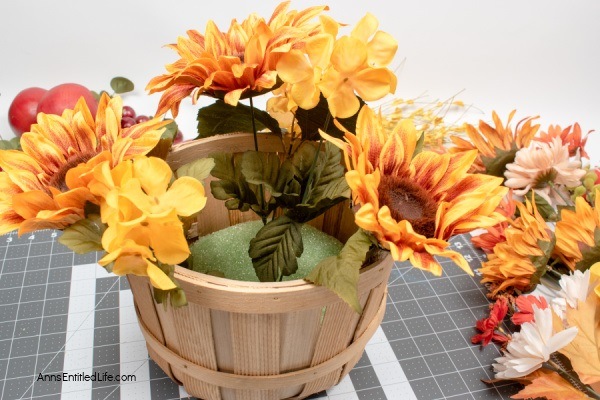 Rustic Fall Centerpiece. This beautiful fall table centerpiece is a must-make for those who like farmhouse decor! If you are looking for a seasonal centerpiece, make this easy rustic fall centerpiece by following these step-by-step instructions.