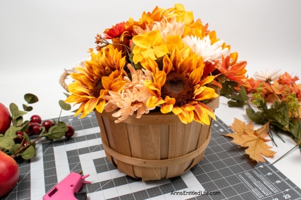 Rustic Fall Centerpiece. This beautiful fall table centerpiece is a must-make for those who like farmhouse decor! If you are looking for a seasonal centerpiece, make this easy rustic fall centerpiece by following these step-by-step instructions.