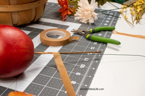 Rustic Fall Centerpiece. This beautiful fall table centerpiece is a must-make for those who like farmhouse decor! If you are looking for a seasonal centerpiece, make this easy rustic fall centerpiece by following these step-by-step instructions.