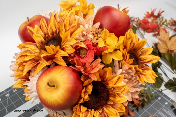 Rustic Fall Centerpiece. This beautiful fall table centerpiece is a must-make for those who like farmhouse decor! If you are looking for a seasonal centerpiece, make this easy rustic fall centerpiece by following these step-by-step instructions.