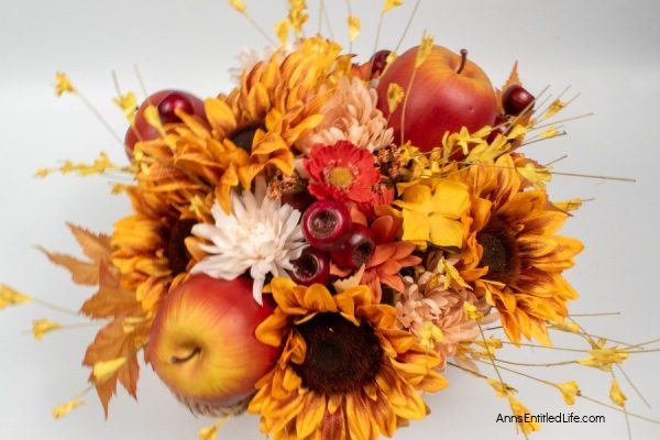 Rustic Fall Centerpiece. This beautiful fall table centerpiece is a must-make for those who like farmhouse decor! If you are looking for a seasonal centerpiece, make this easy rustic fall centerpiece by following these step-by-step instructions.