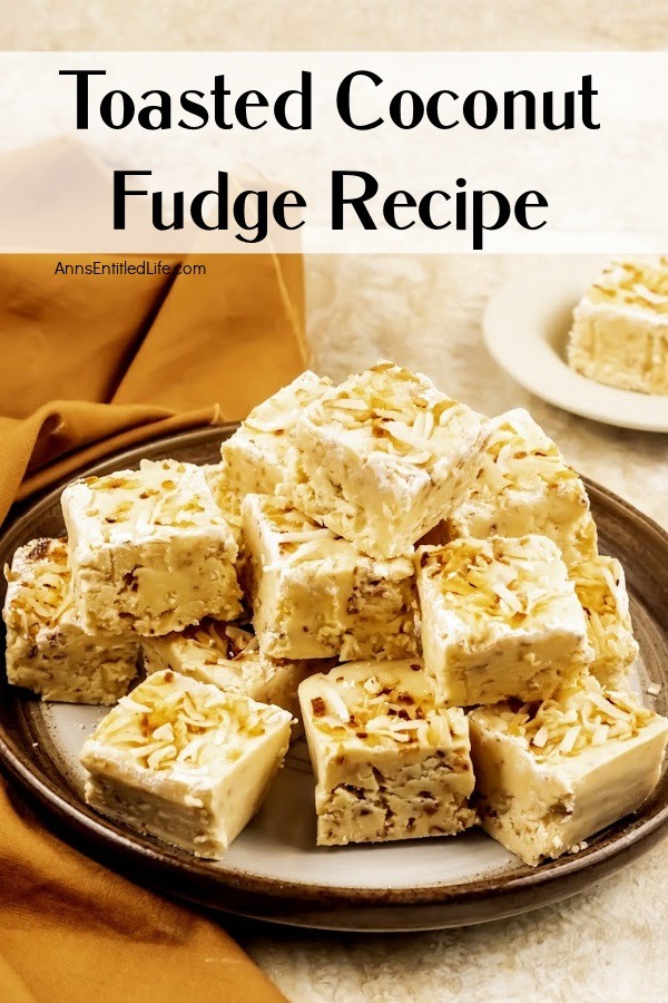 A side view of a creme plate with brown trim piled high with toasted coconut fudge. A single piece on a plate is in the upper right.