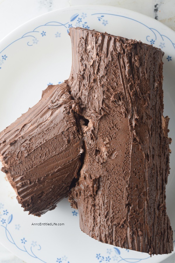 Yule Log Cake Recipe. Yule log cake is also known as Bûche De Noël in French. It is a delicious chocolate sponge cake filled with vanilla whipped cream and covered with chocolate ganache. Yule cake is a traditional Christmas cake that is decorated to resemble a log. This classic Christmas dessert is definitely a showstopper. It not only looks amazing but also it tastes absolutely divine.