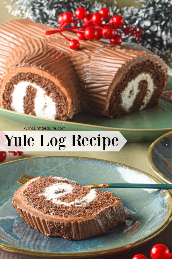 A yule log cake on a green platter with faux cranberries adorning it, a cut piece sits on a plate in front of the yule log cake