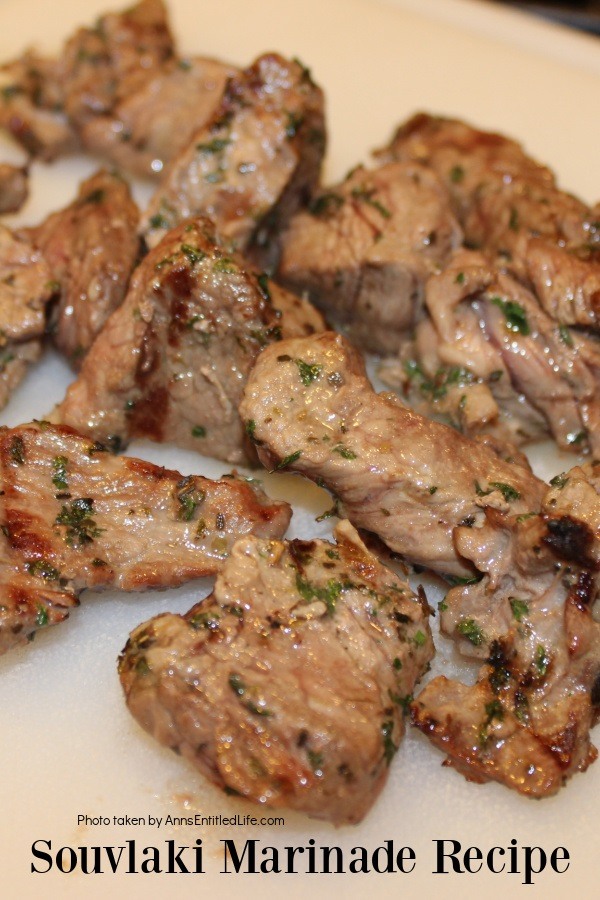 Grilled souvlaki beef chunks on a white board