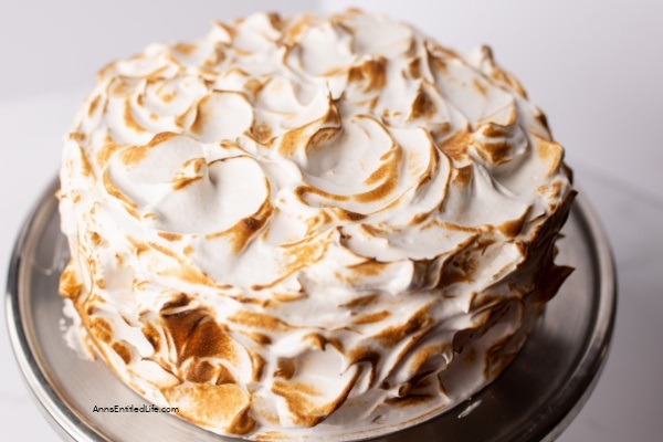 Lemon Meringue Cake Recipe. Layers of lemon cake filled with a lemon curd mixture and topped with a beautiful meringue frosting make for a spectacular presentation. If you like lemon, you will love this delicious lemon meringue cake.