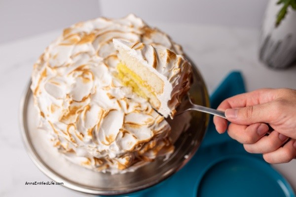 Lemon Meringue Cake Recipe. Layers of lemon cake filled with a lemon curd mixture and topped with a beautiful meringue frosting make for a spectacular presentation. If you like lemon, you will love this delicious lemon meringue cake.