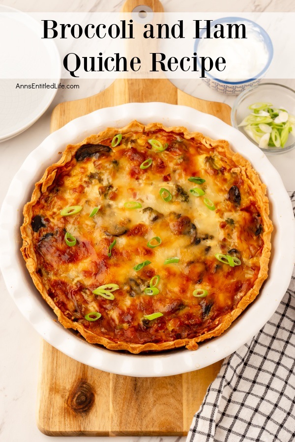 broccoli and ham quiche in a white pie pan set on a wooden board