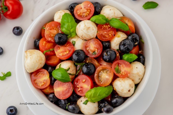 Red, White, and Blue Caprese Salad Recipe. Looking for a festive summertime Caprese salad recipe? Try this red, white, and blue Caprese salad. Made with fresh tomatoes, blueberries, and basil, this updated Caprese salad recipe is perfect for the 4th of July, summertime picnics, or a Memorial Day BBQ.