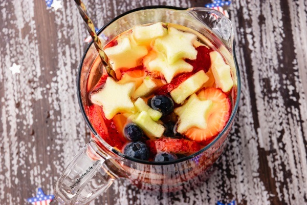 Red, White, and Blue Sangria Recipe. This Red, White, and Blue Sangria is simple to make. Bursting with juicy fruits and delicious flavors it is the perfect drink to celebrate Independence Day, Memorial Day, or any summer holiday.