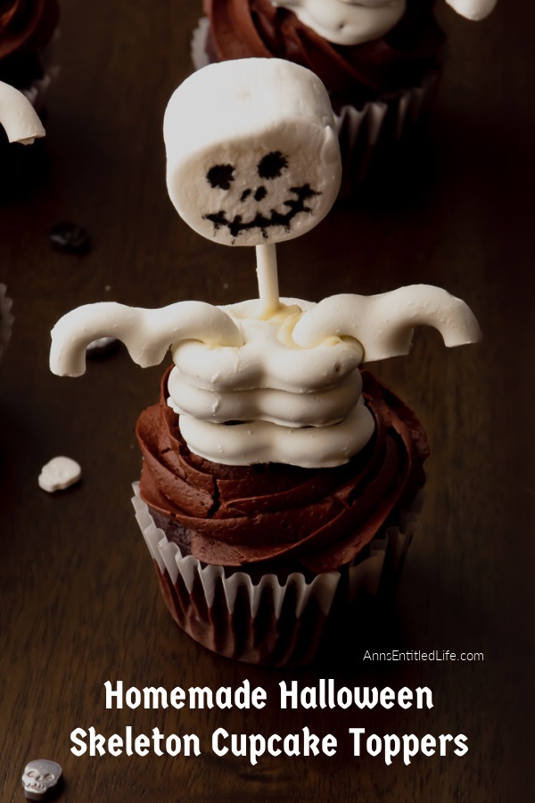 One  Halloween skeleton cupcake against a dark background