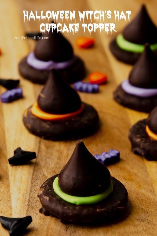 Six Halloween witch's hat topper on a butcher block