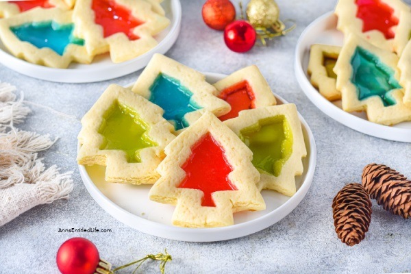 Stained Glass Cookies Recipe. Delicious and crisp sugar cookies are cut into shapes and filled with hard candies, which give a beautiful stained-glass effect after they are baked. These cookies are easy to make and look gorgeous. A delightful, simple, and mouthwatering treat to add to your Christmas cookies list.