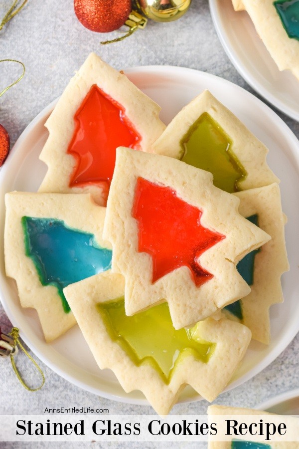 Up close photo of a white plate filled with stained glass window cookies