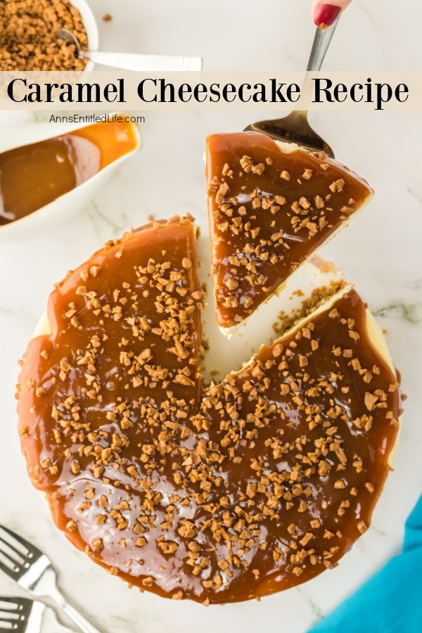 An overhead view of a caramel cheesecake with one piece being lifted up on a cake lifter.