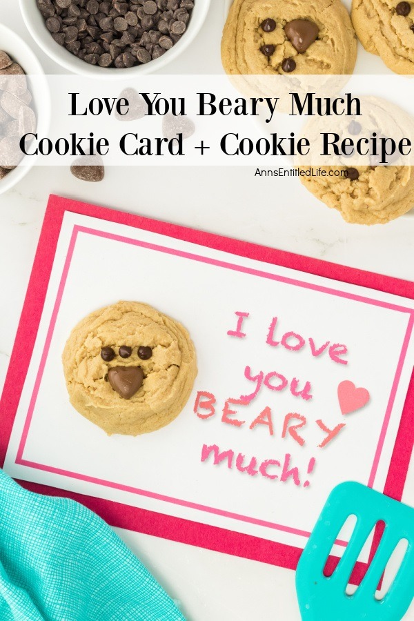 One Love you beary much cookie cards surrounded by chocolate chips, more cookies, and a blue spatula