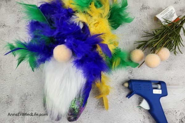 Mardi Gras Gnome DIY. Follow these simple step-by-step directions to make this fabulous Mardi Gras gnome! Perfect for Mardi Gras decorations and inexpensive to make, these flamboyant gnomes are terrific Mardi Gras decor.