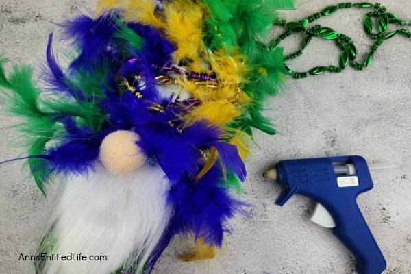 Mardi Gras Gnome DIY. Follow these simple step-by-step directions to make this fabulous Mardi Gras gnome! Perfect for Mardi Gras decorations and inexpensive to make, these flamboyant gnomes are terrific Mardi Gras decor.