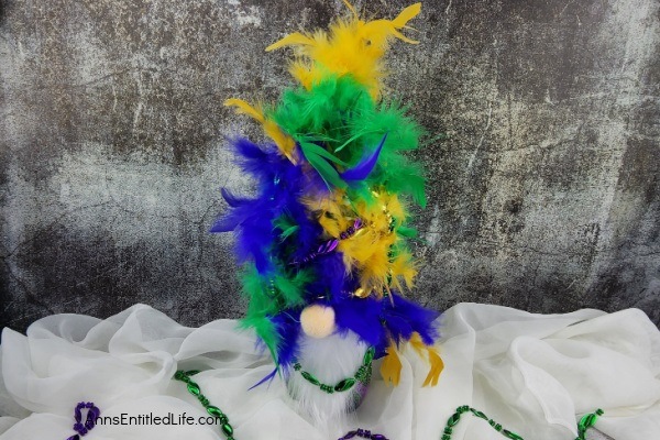 Mardi Gras Gnome DIY. Follow these simple step-by-step directions to make this fabulous Mardi Gras gnome! Perfect for Mardi Gras decorations and inexpensive to make, these flamboyant gnomes are terrific Mardi Gras decor.