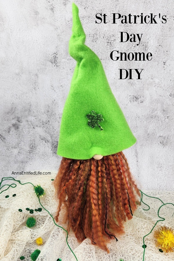 a homemade st Patrick's day gnome on a mesh cloth against a marble background