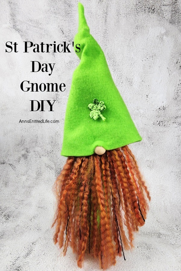 a homemade st Patrick's day gnome on a mesh cloth against a marble background