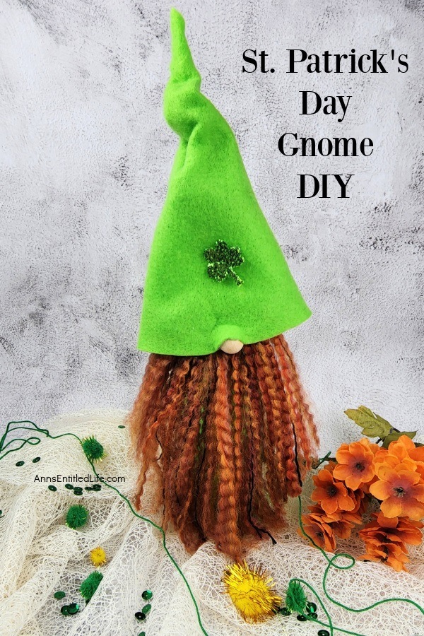 a homemade st Patrick's day gnome on a mesh cloth against a marble background