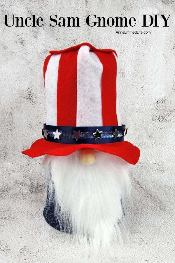a homemade patriotic gnome that resembles Uncle Sam against a marble top and background