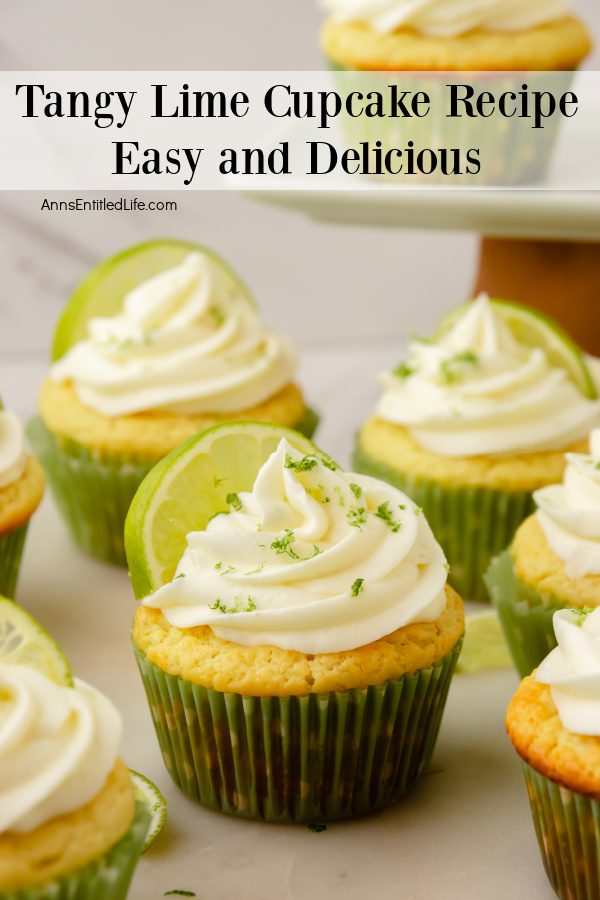 front view of six frosted and decorated lime cupcakes in green wrappers on a white surface. There are some cut limes strewn about the surface, too.