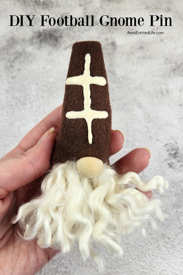 A homemade football gnome pin being held up