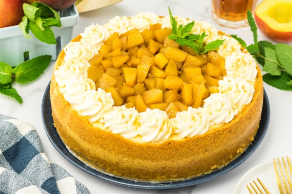 Fresh and Easy Peach Rum Cheesecake Recipe. Dive into a slice of paradise with this delightful peach rum cheesecake recipe. Experience the tantalizing blend of juicy peaches, creamy cheesecake, and a touch of rum. Prepare to be swept away by the flavors and taste of this heavenly dessert.