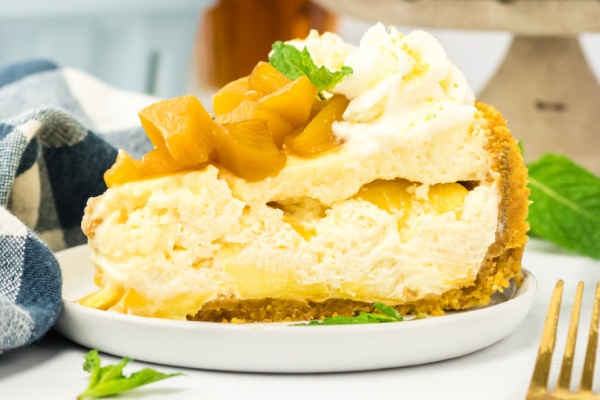 Fresh and Easy Peach Rum Cheesecake Recipe. Dive into a slice of paradise with this delightful peach rum cheesecake recipe. Experience the tantalizing blend of juicy peaches, creamy cheesecake, and a touch of rum. Prepare to be swept away by the flavors and taste of this heavenly dessert.