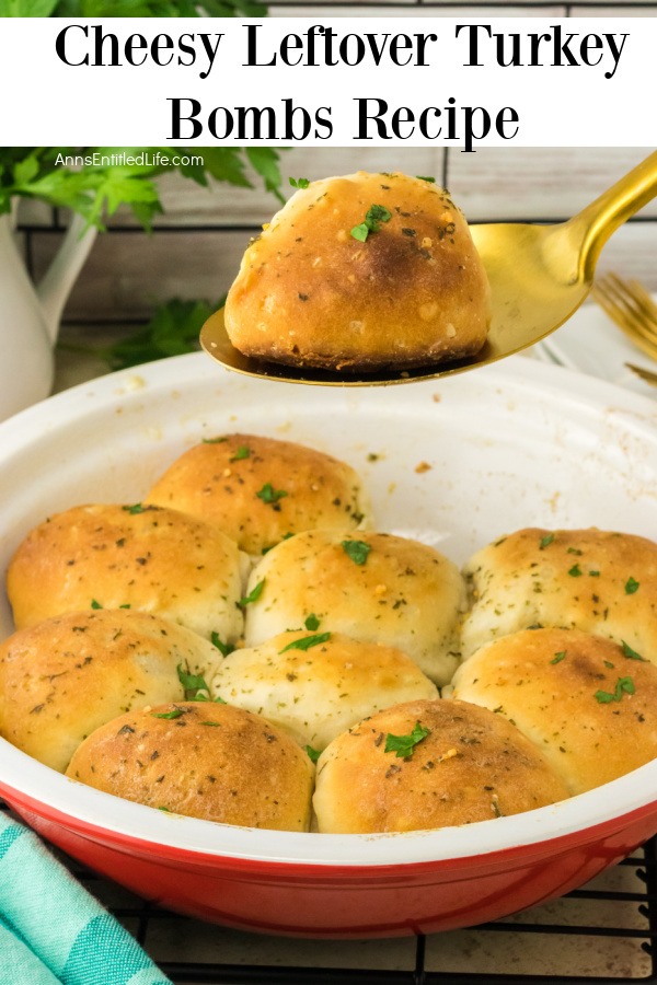 A red, deep dish pie plate is filled with cheesy turkey bombs. One is being lifted out on a gold spoon