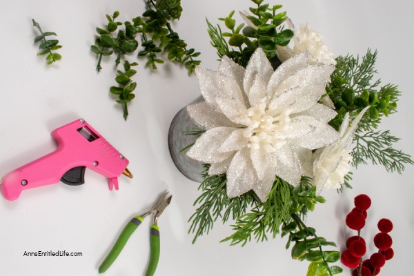 Easy-to-Make Rustic Christmas Centerpiece. Discover step-by-step instructions for creating a beautiful DIY Christmas centerpiece to elevate your holiday table decor. Bring festive cheer to your table with this creative holiday project.