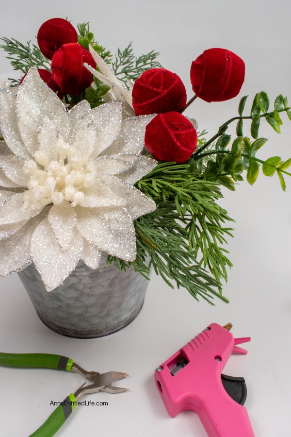 Easy-to-Make Rustic Christmas Centerpiece. Discover step-by-step instructions for creating a beautiful DIY Christmas centerpiece to elevate your holiday table decor. Bring festive cheer to your table with this creative holiday project.