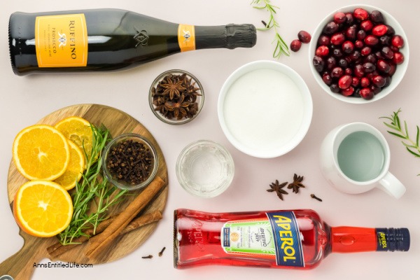 Festive Winter Cranberry Spritz Aperol Recipe. Enjoy the holiday season's flavors with this refreshing winter cranberry spritz Aperol beverage. This is a perfect blend of flavors for a festive winter cocktail. Cheers!