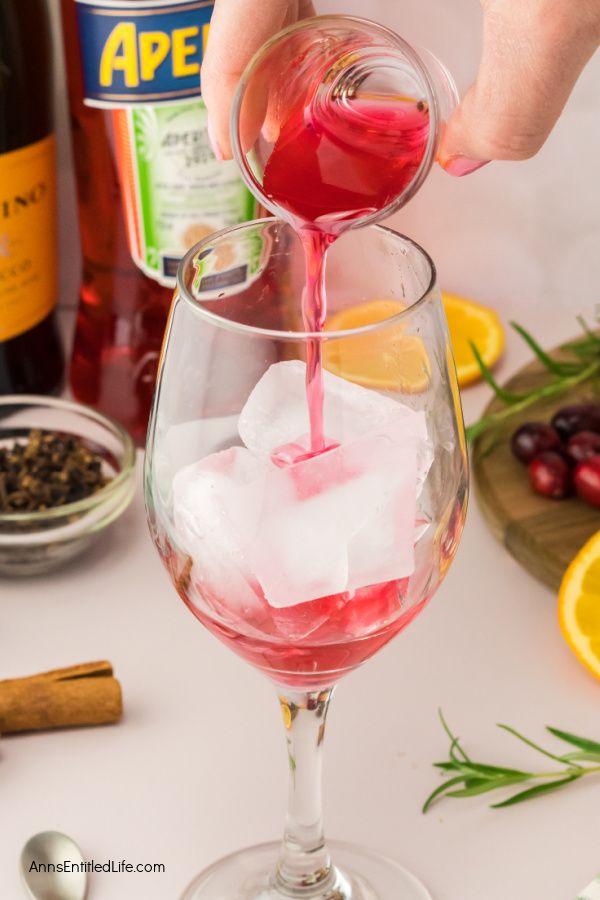 Festive Winter Cranberry Spritz Aperol Recipe. Enjoy the holiday season's flavors with this refreshing winter cranberry spritz Aperol beverage. This is a perfect blend of flavors for a festive winter cocktail. Cheers!
