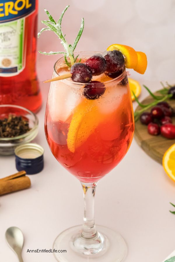 Festive Winter Cranberry Spritz Aperol Recipe. Enjoy the holiday season's flavors with this refreshing winter cranberry spritz Aperol beverage. This is a perfect blend of flavors for a festive winter cocktail. Cheers!