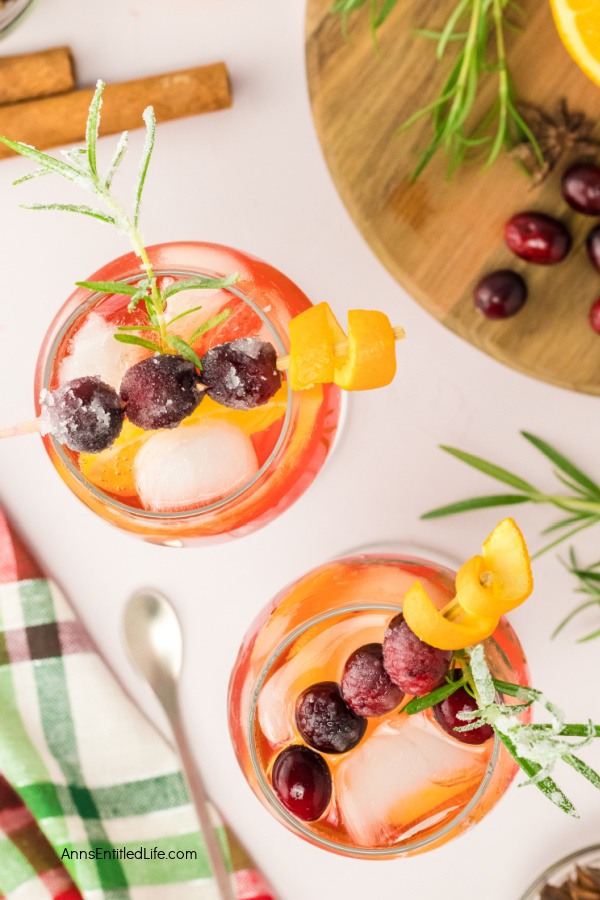 Festive Winter Cranberry Spritz Aperol Recipe. Enjoy the holiday season's flavors with this refreshing winter cranberry spritz Aperol beverage. This is a perfect blend of flavors for a festive winter cocktail. Cheers!