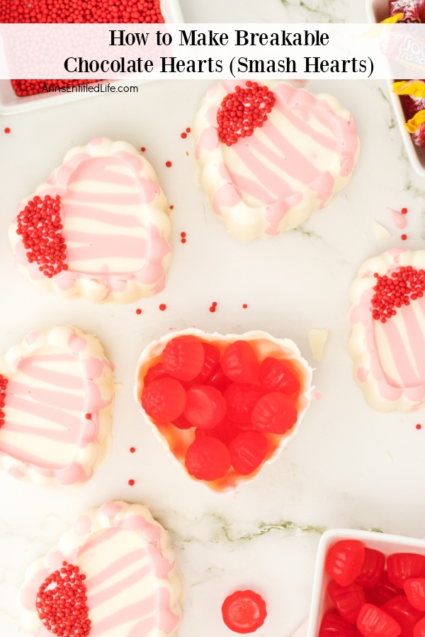 An overheart view of six white chocolate hearts sitting on a white platter.