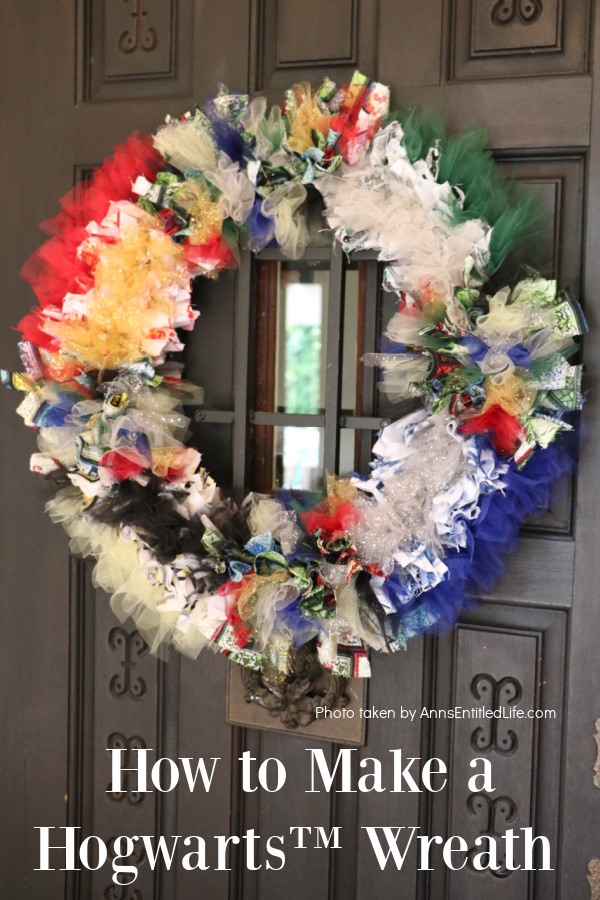 homemade Hogwarts wreath against a black door