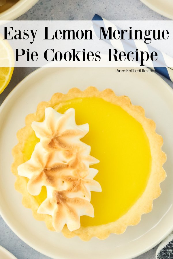 A lemon meringue pie cookie sits on a white plate