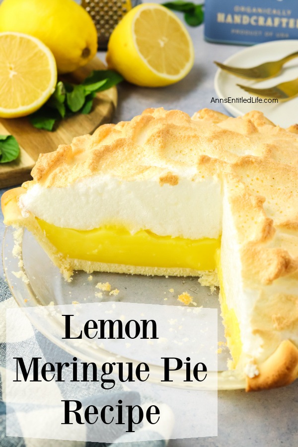 a side view of a cut lemon meringue pie (there are two pieces missing)