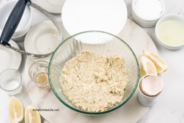Lemon Poppy Seed Scones Recipe with Glaze. This lemon poppy seed scones recipe features a delicious lemon glaze. The result is moist scones bursting with poppy seeds and freshly grated lemon zest. This lemon-flavored scones recipe goes well with afternoon tea or morning coffee.